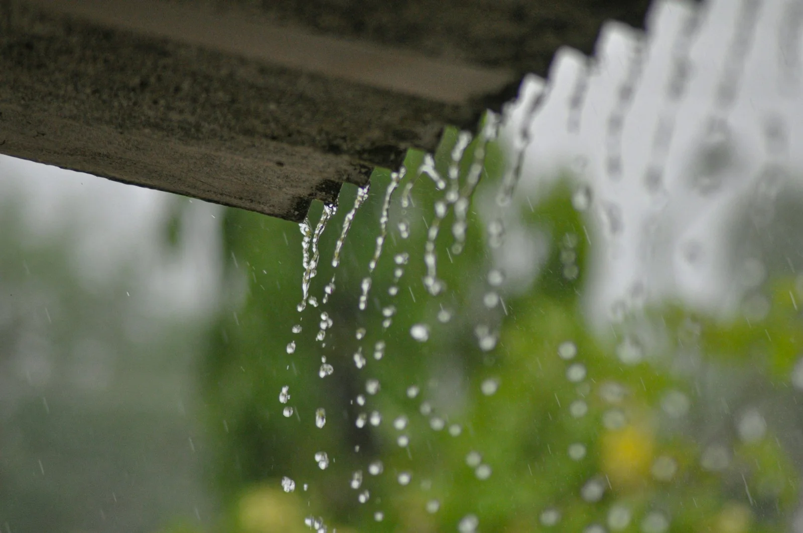 Rainwater harvesting in Delhi: rain streaming off a roof into a harvesting system